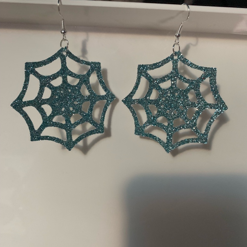 Spiderwebbed faux leather earrings